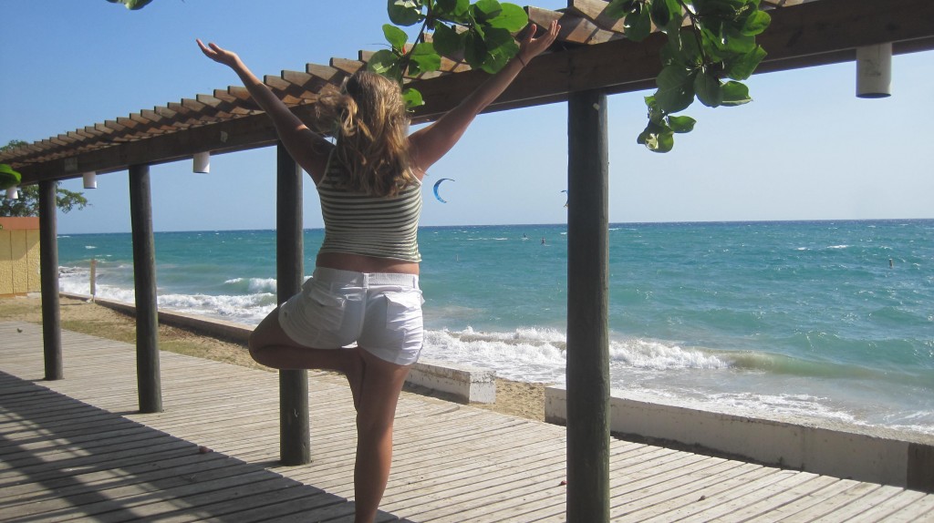 Tree pose yoga on beach