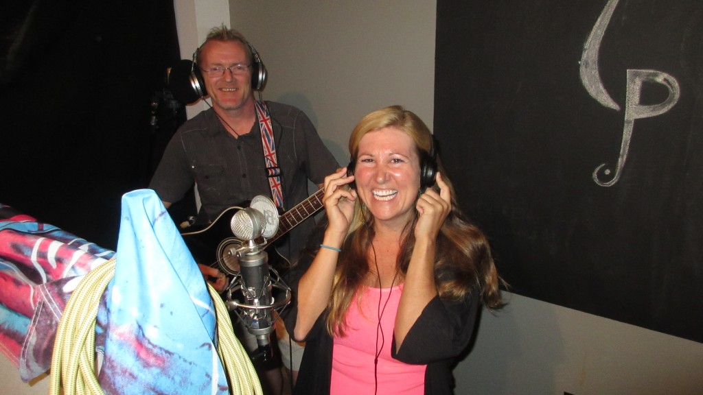 Chris and Cassie singing behind